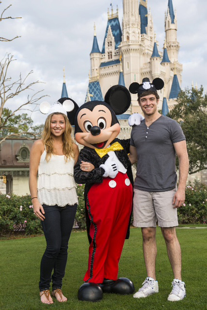 Broadway actor Corey Cott and his wife Meghan with Mickey Mouse at the Walt Disney World Resort