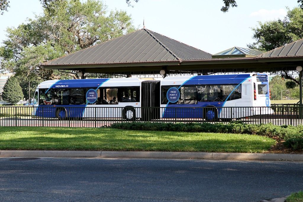 If you aren't familiar with articulated buses, they are essentially double-buses that comprise two rigid (bus) sections linked by a pivoting joint.  Think of a two-piece bus that bends in the middle!