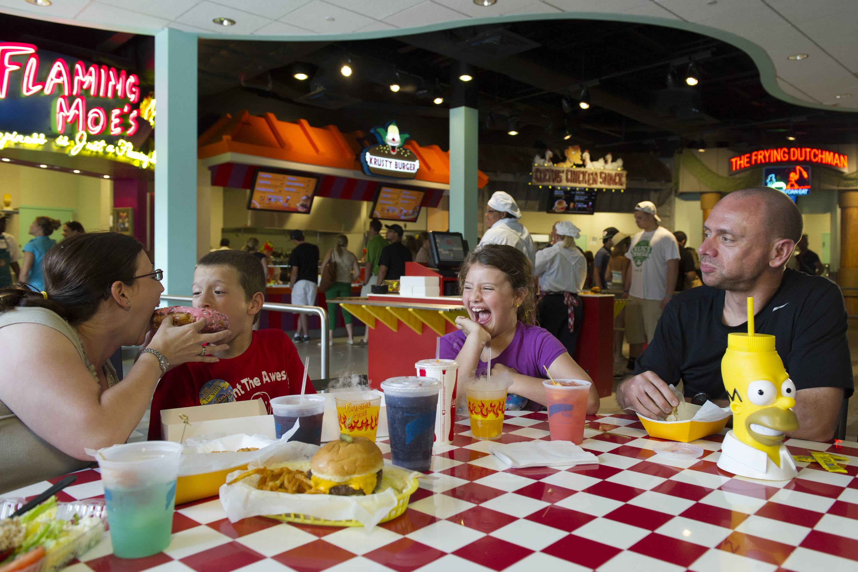 Doh! JUST OPENED: MoeÕs Tavern, Krusty Burger and more iconic Springfield eateries are now open at Universal Studios Florida Ð and these guests were among the first to chow down on some of the unique dishes from The Simpsons. For the first time ever, guests can visit some of the eateries located on SpringfieldÕs famed Fast Food Boulevard, including Krusty Burger, MoeÕs Tavern, CletusÕ Chicken Shack, LisaÕs Teahouse of Horror, LuigiÕs Pizza, Frying Dutchman, and Flaming MoeÕs.   Later this summer, Springfield will also feature additional landmarks and experiences inspired by The Simpsons, including the all-new attraction, Kang & KodosÕ Twirl ÔnÕ Hurl. For more information, visit www.UniversalOrlando.com.